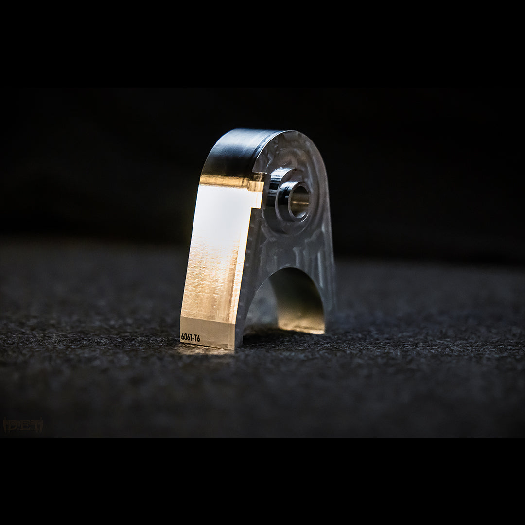 side profile of N400 Tacoma tailgate lock. 3/4-inch thick 6061-T6 billet aluminum showing machine finish and structural thickness.
